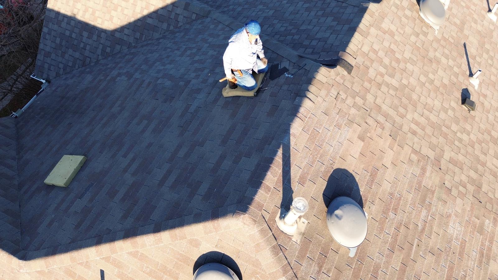 Shingle roof repair in progress