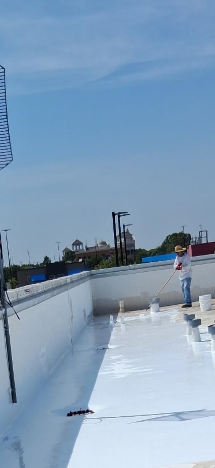 Roof coating work in progress
